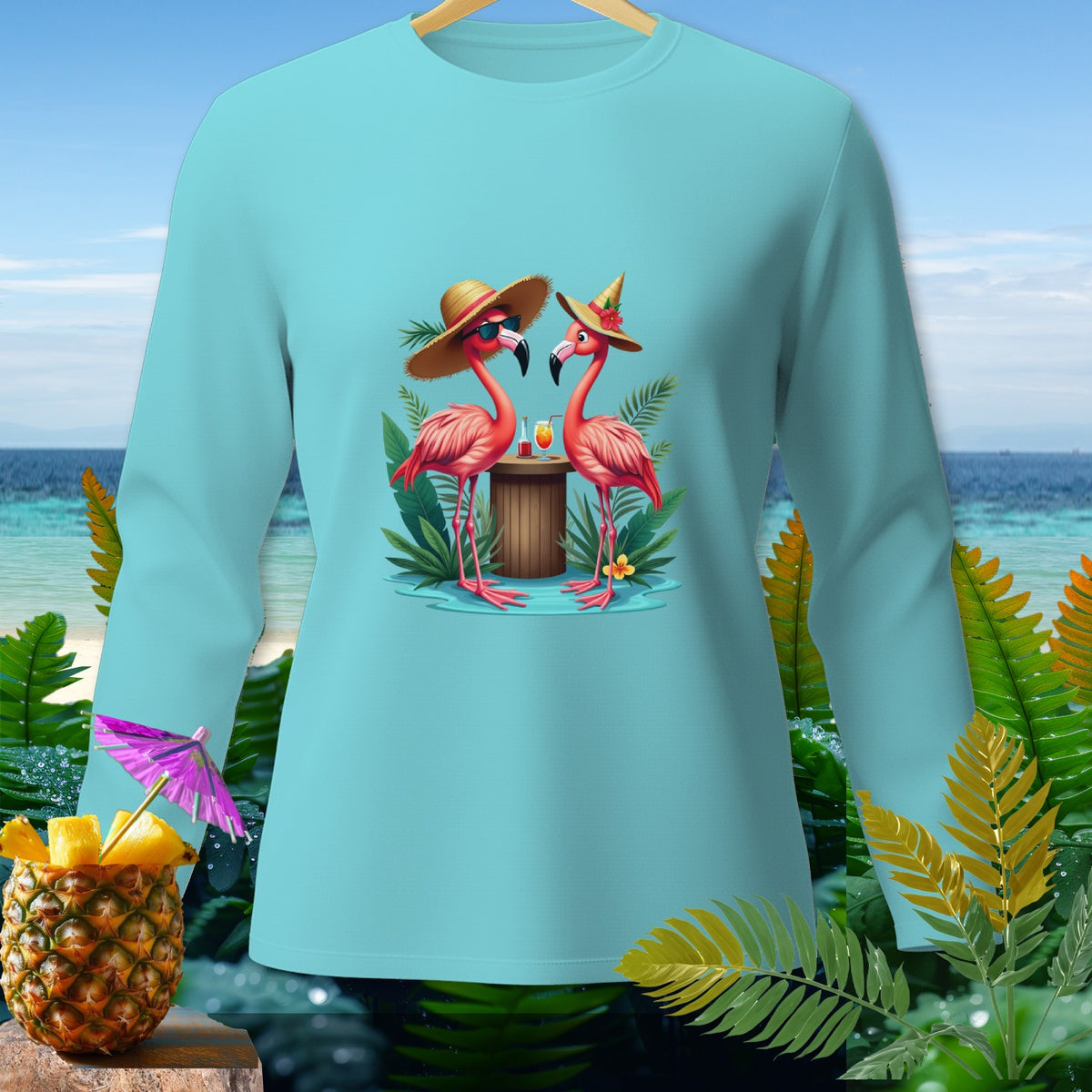 Light blue long sleeve shirt with two flamingos in hats and sunglasses.