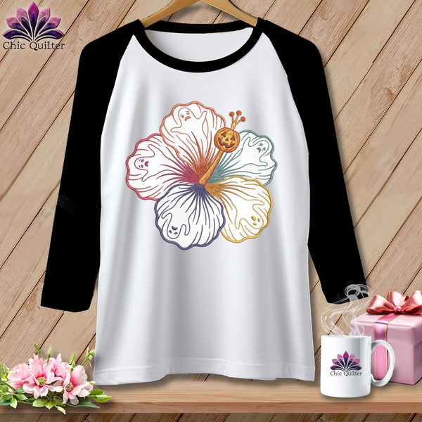 Raglan t-shirt with a colorful hibiscus flower design featuring ghosts and a pumpkin.
