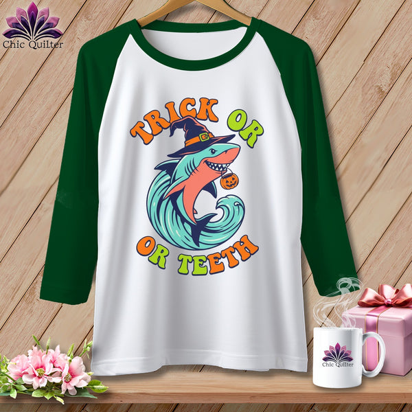 Halloween shark with pumpkin and text "Trick or Or Teeth" on t-shirt.