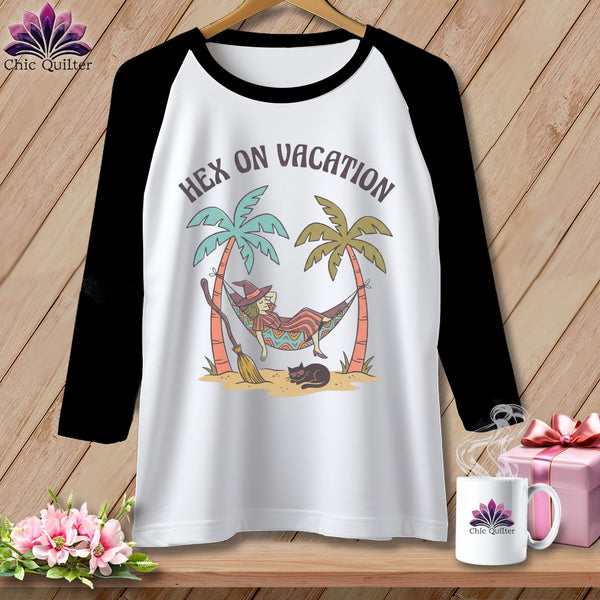 Raglan shirt with witch and cat on a tropical beach, "Hex on Vacation" text.