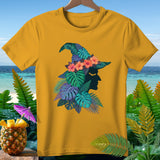 Yellow t-shirt with witch silhouette and tropical foliage design.