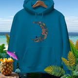 Teal hoodie with a crescent moon floral design featuring a surfer.