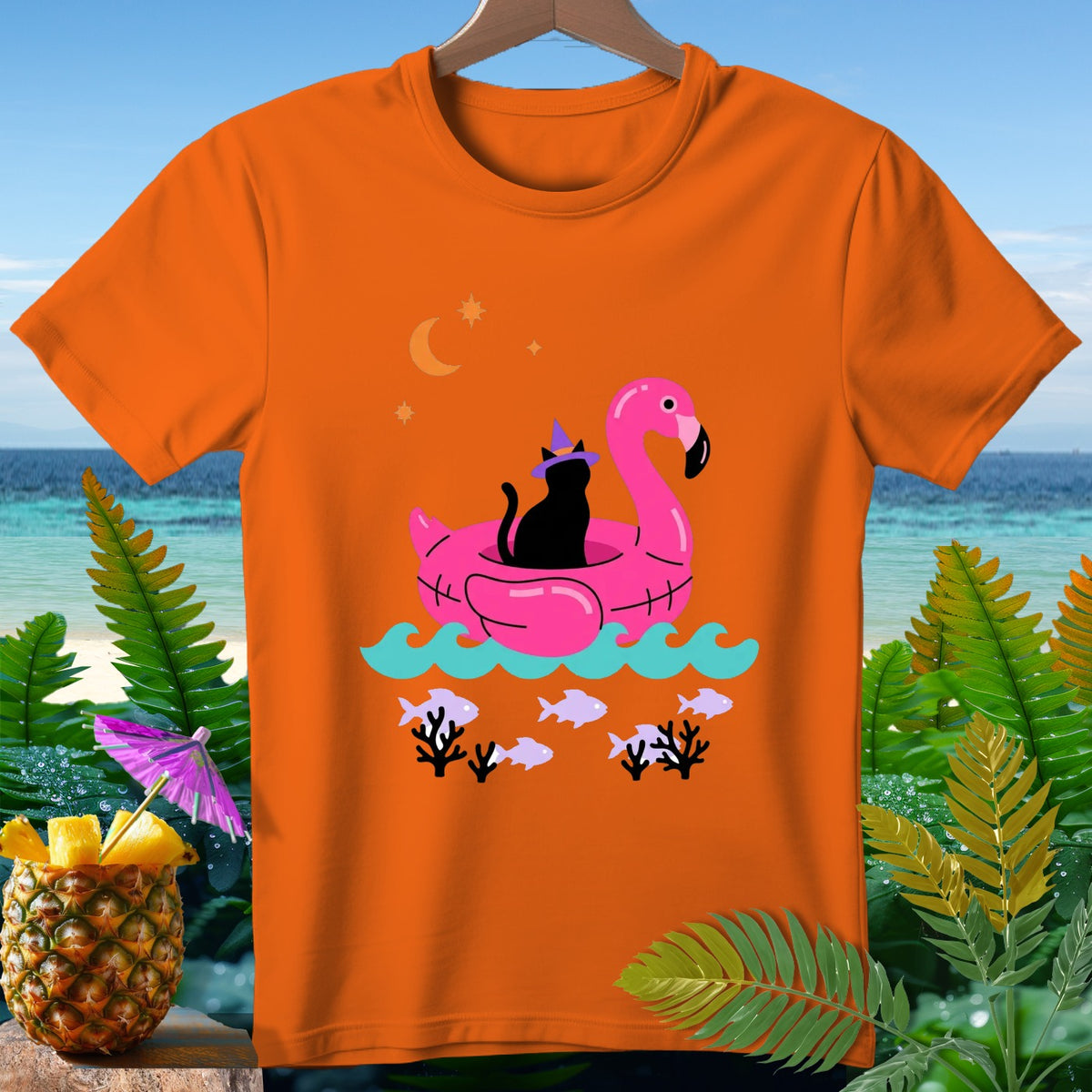 Orange t-shirt with a black cat wearing a witch hat on a pink flamingo float.