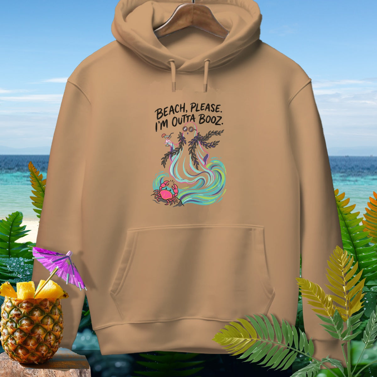 Tan hoodie with "Beach, Please. I'm Outta Booze." graphic featuring a crab.