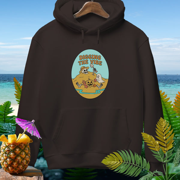 Brown hoodie with oval graphic of skeleton, ghost, pumpkin, and text "DIGGING THE VIBE".