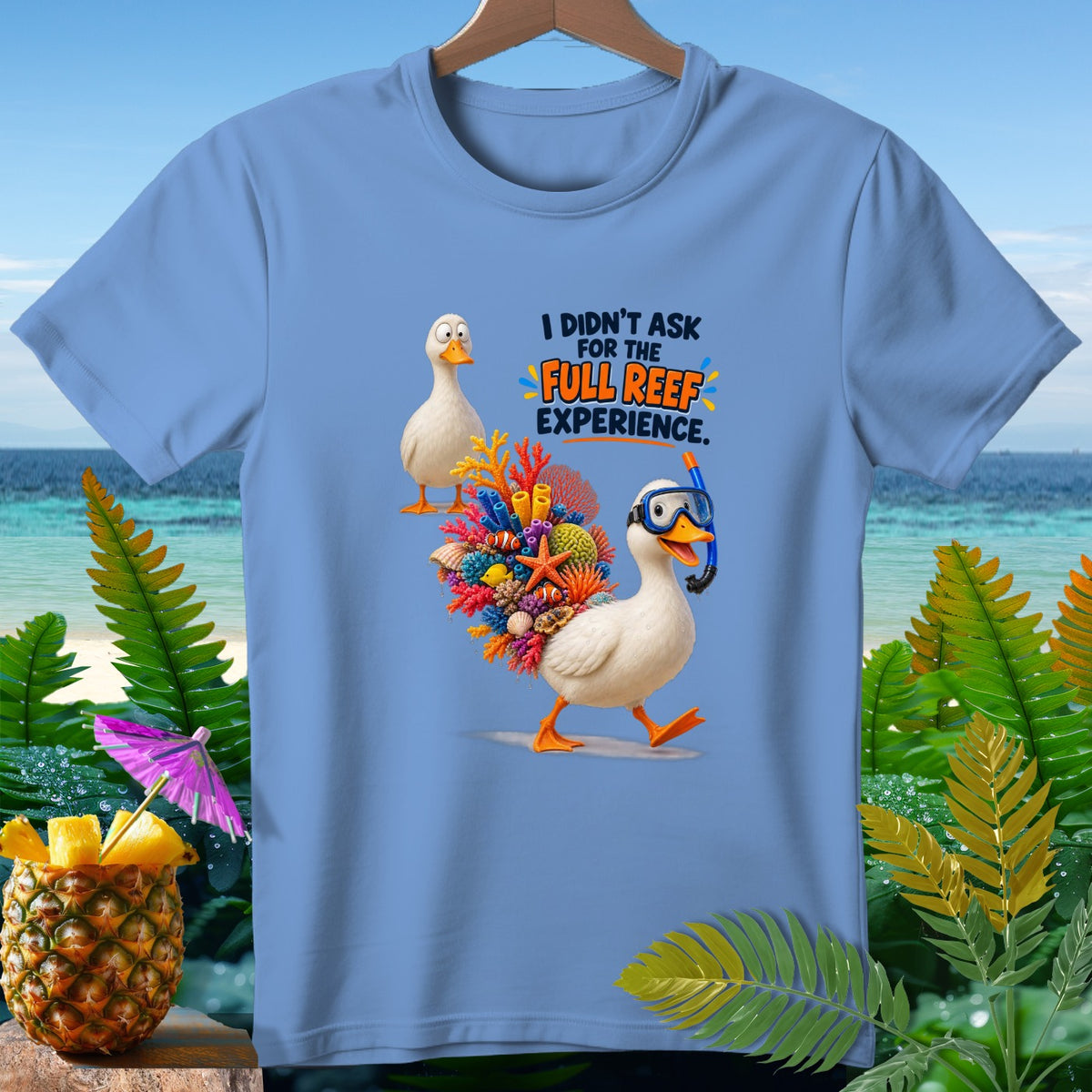 Light blue t-shirt with ducks and coral reef graphic reading "I didn't ask for the full reef experience."