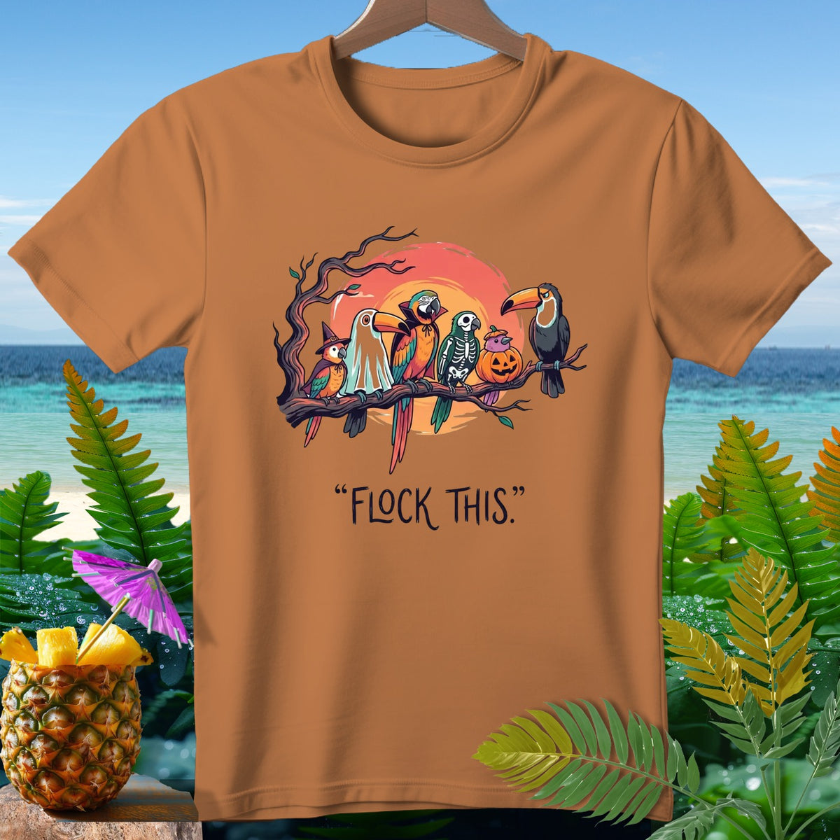 Orange t-shirt with Halloween parrots and text "FLOCK THIS."