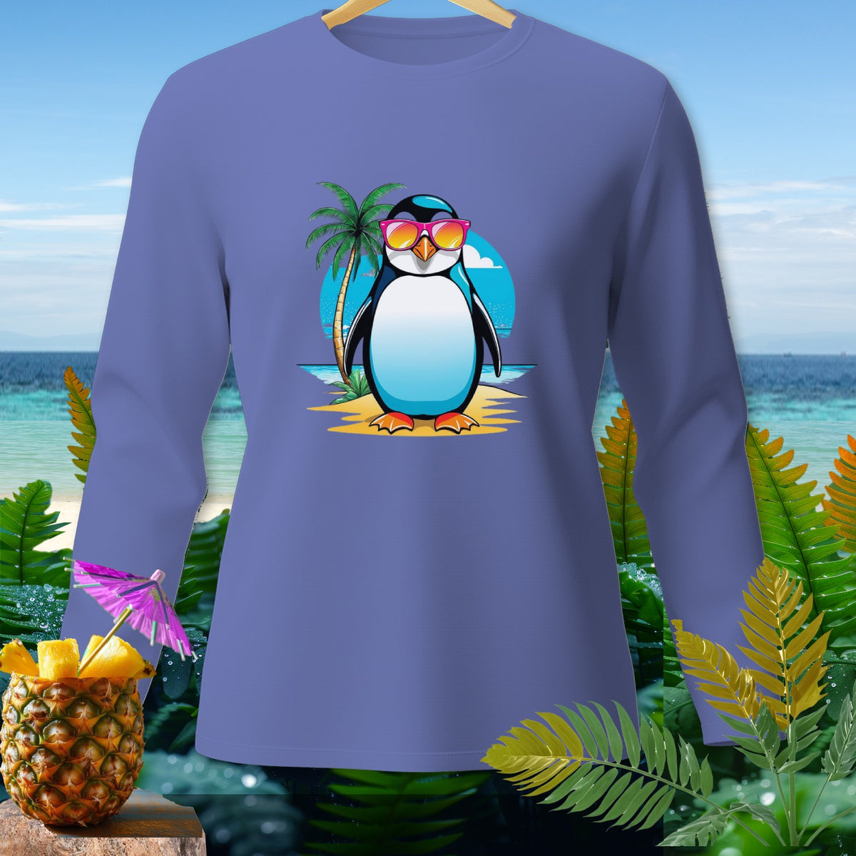 Long sleeve shirt featuring a cartoon penguin wearing sunglasses on a beach.