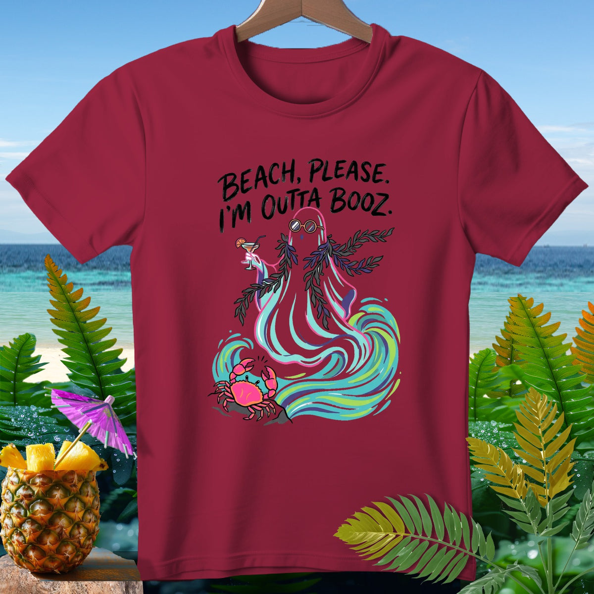 Maroon t-shirt with ghost saying "BEACH, PLEASE. I'M OUTTA BOOZ." and a crab.