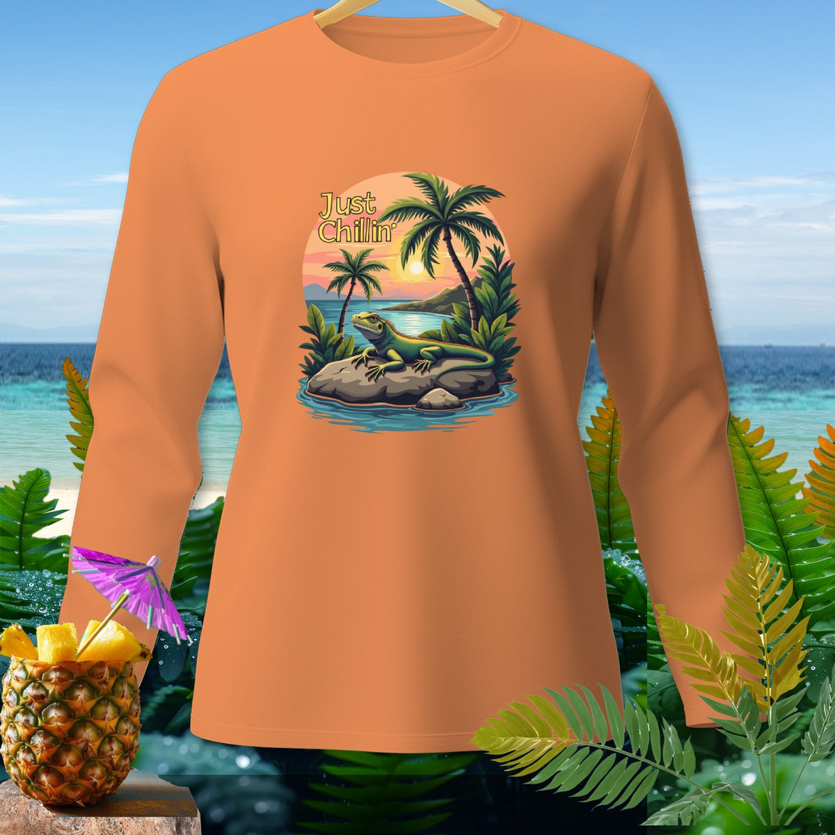 Orange long-sleeve shirt with "Just Chillin" text and iguana tropical scene graphic.