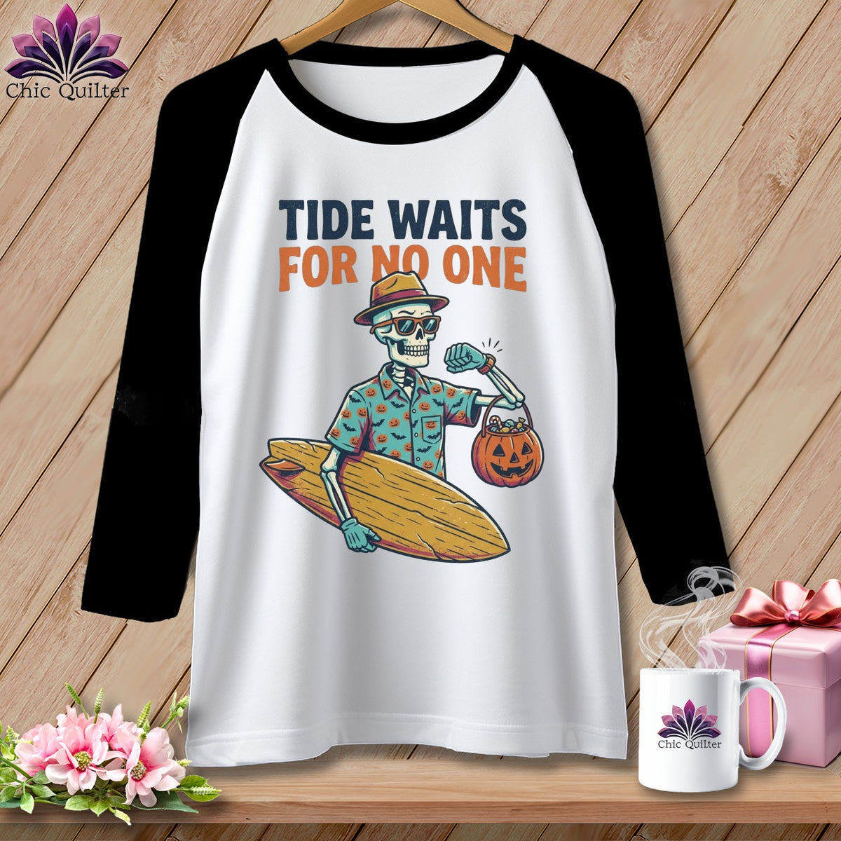 White baseball tee with skeleton holding surfboard and pumpkin bag, "Tide Waits For No One" text.