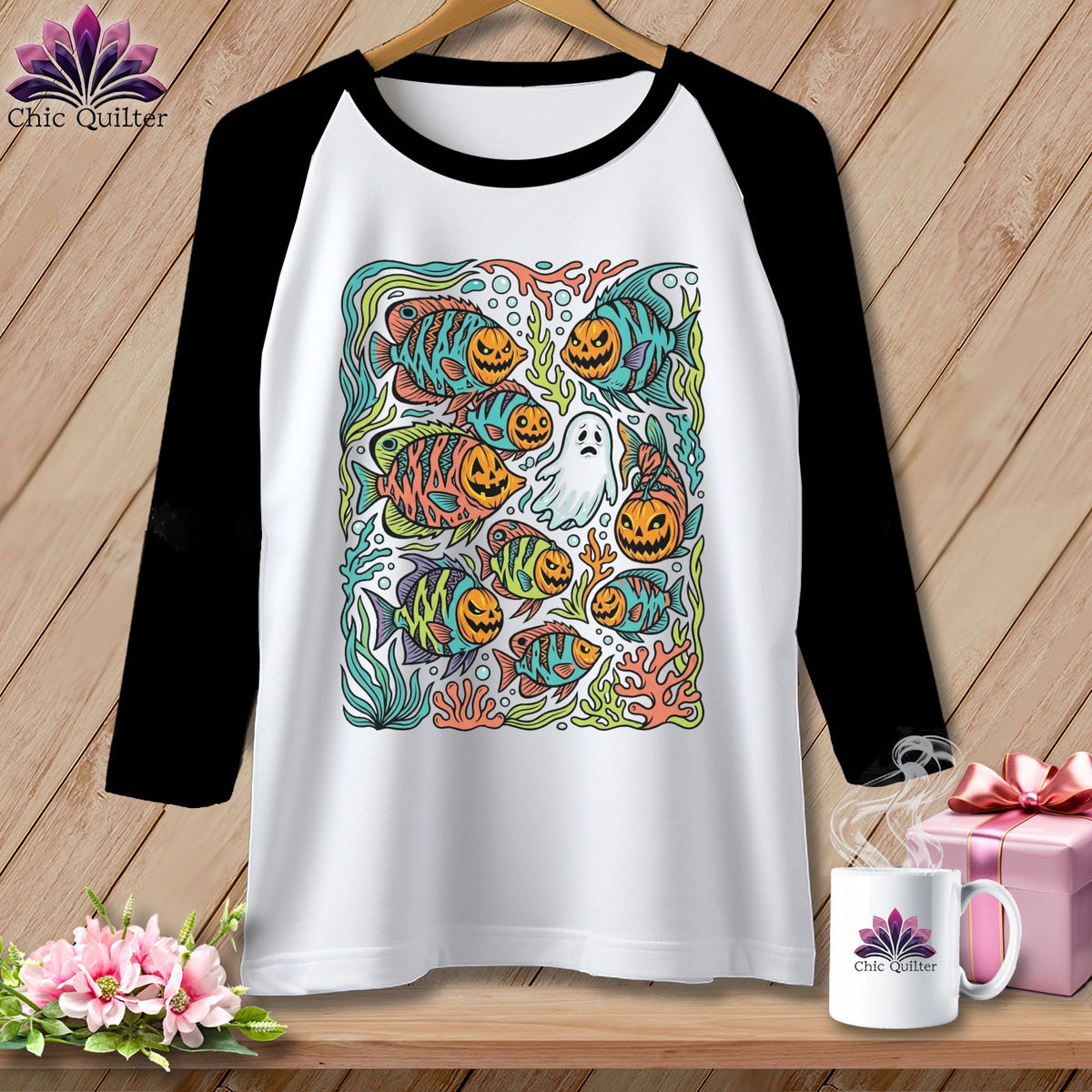 Raglan t-shirt featuring Halloween fish, pumpkins, and a ghost design.