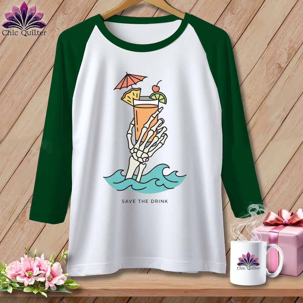 Raglan t-shirt with skeleton hand holding cocktail in waves, text "SAVE THE DRINK."