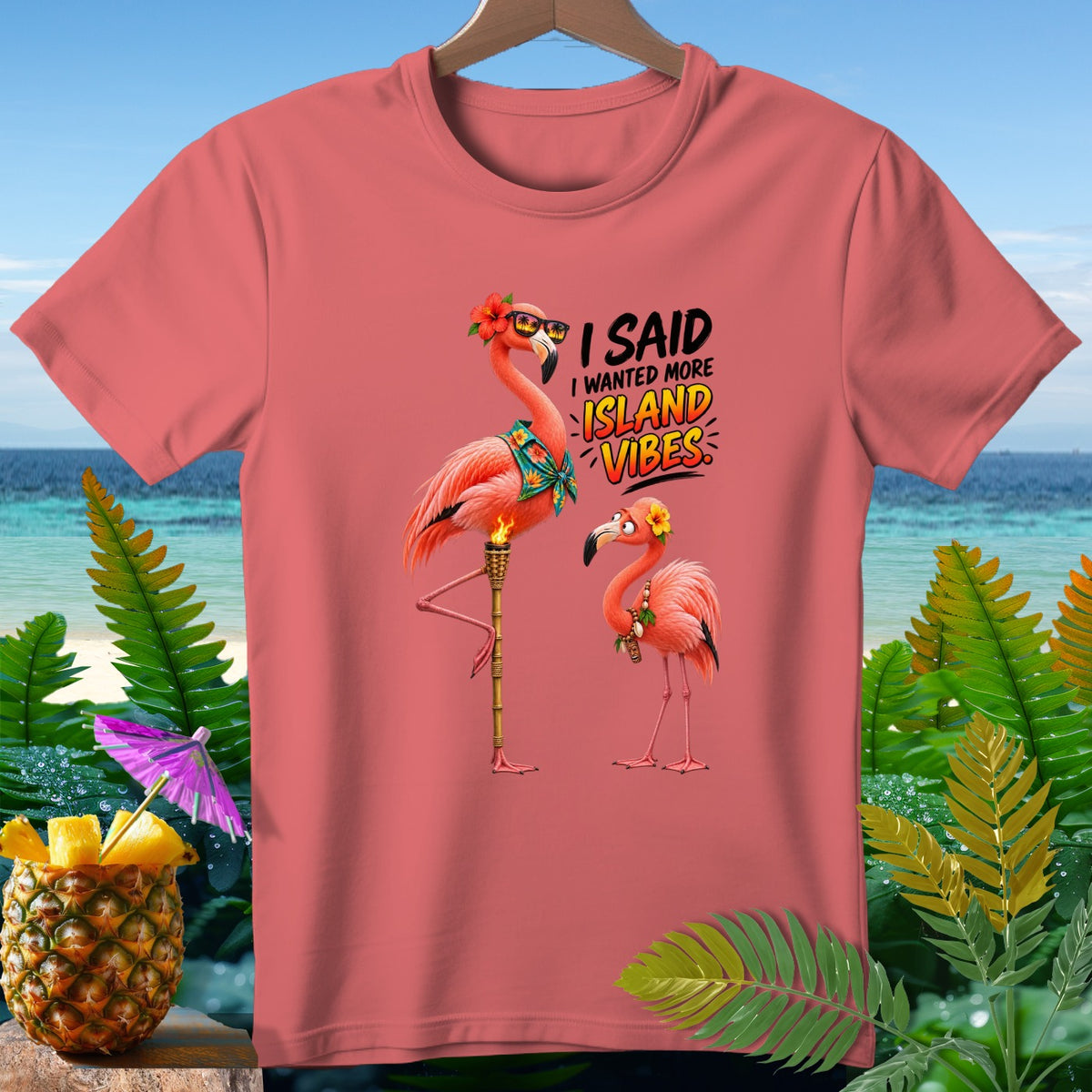 T-shirt with cartoon flamingos and "I Said I Wanted More Island Vibes" text.