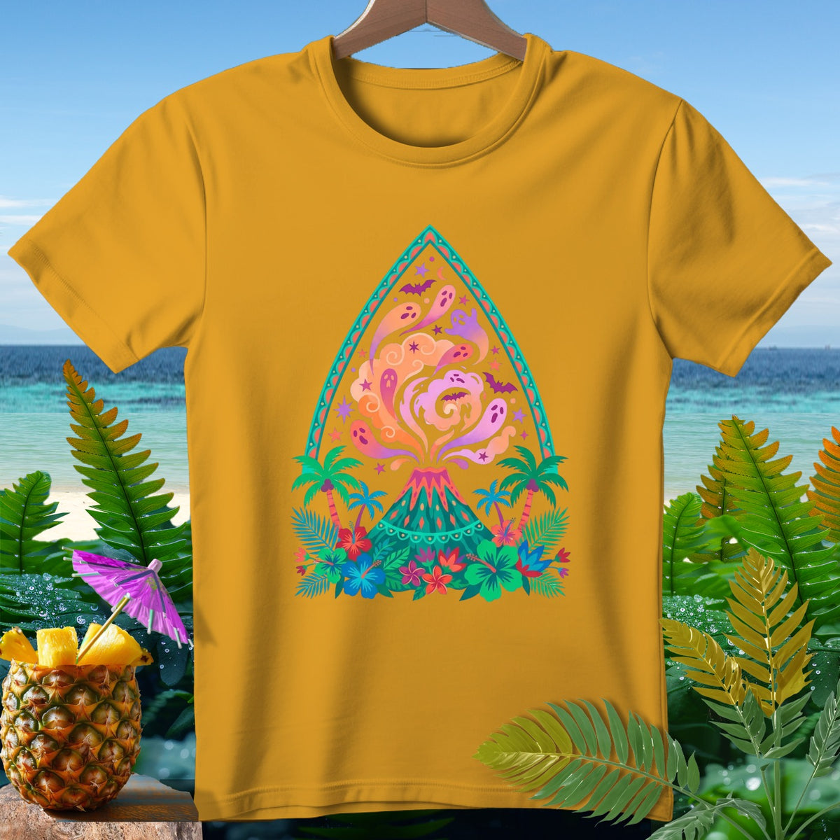 Yellow t-shirt with a colorful volcano, ghosts, bats, and tropical plants design.