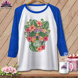 White raglan t-shirt with blue sleeves featuring a colorful floral skull design.
