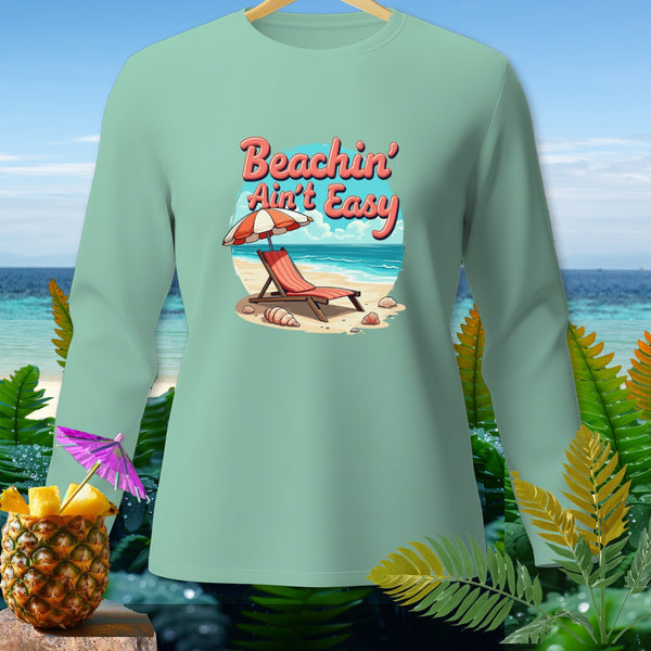 Long sleeve mint t-shirt with "Beachin' Ain't Easy" text and beach scene graphic.