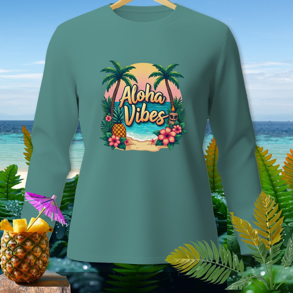 Teal long-sleeve shirt with "Aloha Vibes" tropical beach graphic and pineapple.