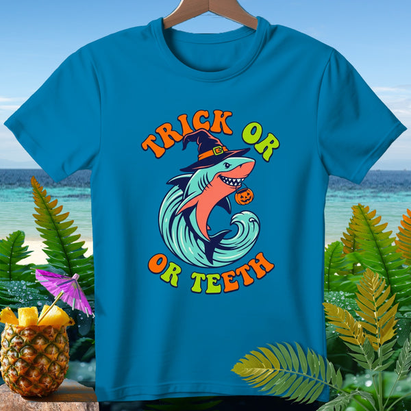 Blue t-shirt with a shark wearing a witch hat and pumpkin, text "Trick or Teeth".