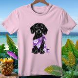 Pink t-shirt with black dachshund wearing a purple floral bandana against a tropical backdrop.