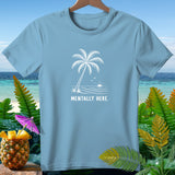 Light blue t-shirt with a white graphic of a palm tree, waves, and the text 