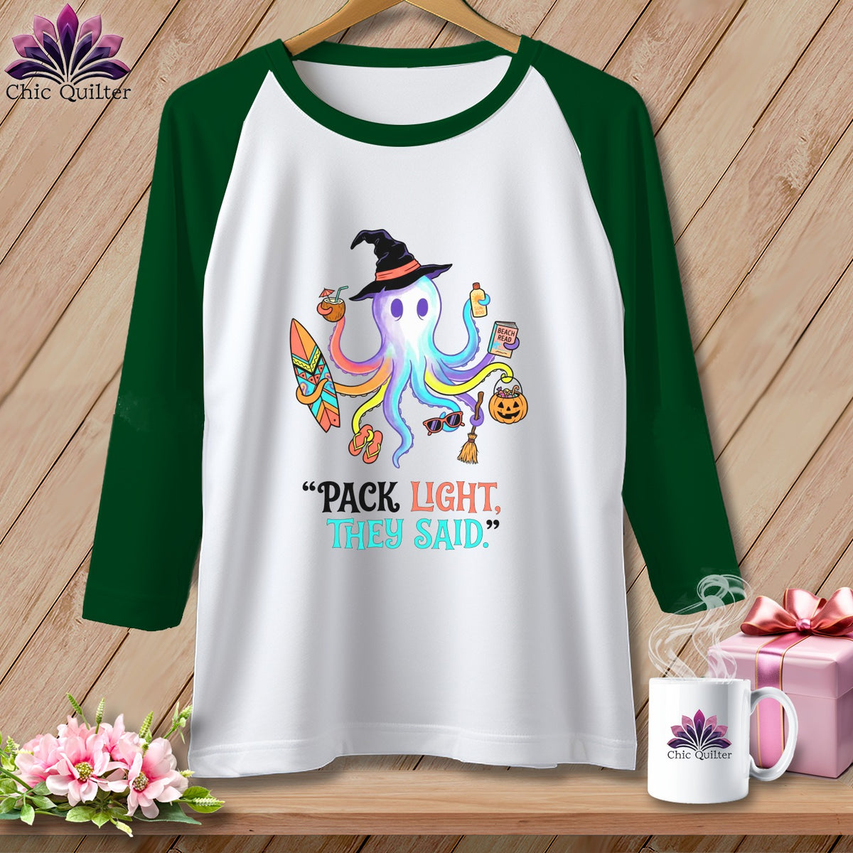 Raglan t-shirt with colorful octopus wearing witch hat, holding beach items.