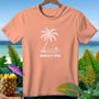 Peach t-shirt with white palm tree, ocean, and sun graphic and text.