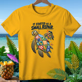 Yellow t-shirt with cartoon sea turtles and text 