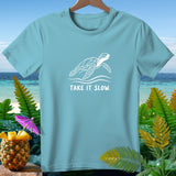 Light blue t-shirt with white sea turtle graphic and text 