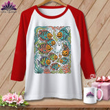 White raglan t-shirt with Halloween fish, pumpkins, and ghost graphic.