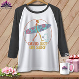 White baseball tee with skeleton carrying a floral surfboard and ghost, text 
