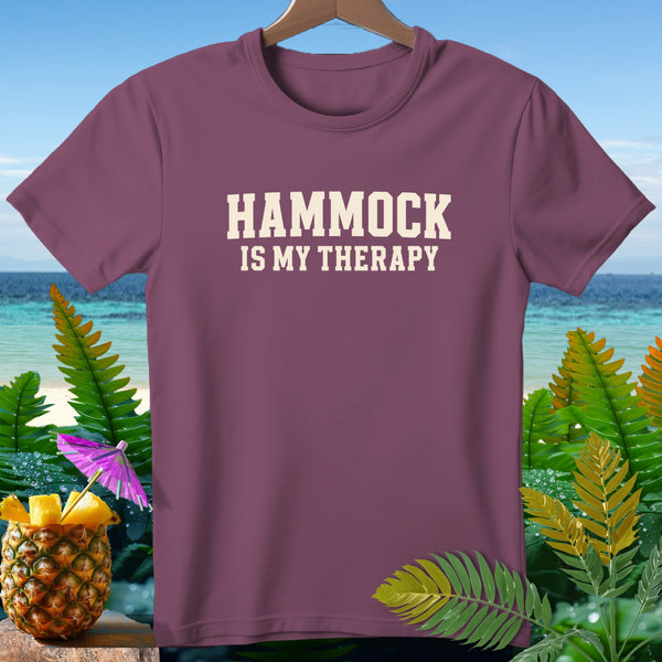 Maroon t-shirt with "HAMMOCK IS MY THERAPY" text, tropical background.