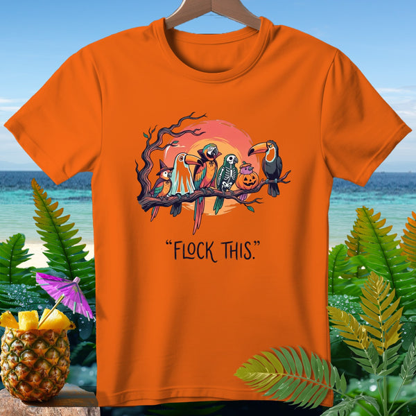 Orange t-shirt with Halloween-themed parrots on a branch, "FLOCK THIS" text.
