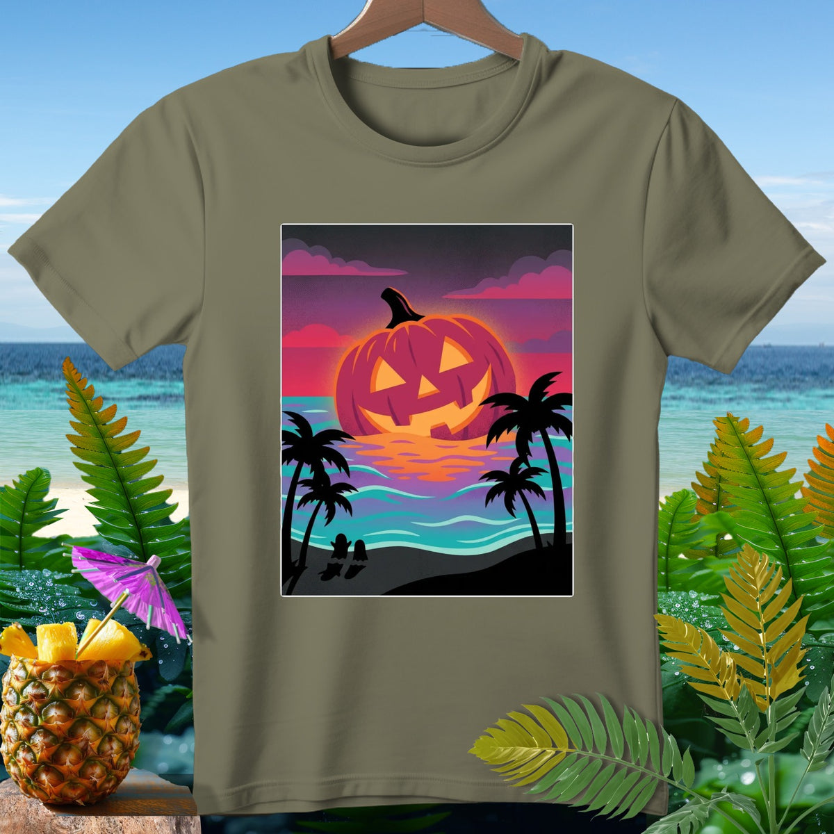 T-shirt with a glowing jack-o'-lantern on a tropical beach at sunset.