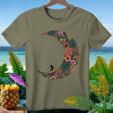 Olive t-shirt featuring a crescent moon design filled with tropical foliage and a surfer.