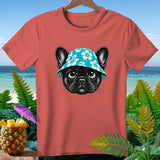 Coral t-shirt with black French bulldog wearing blue floral hat, beach background.