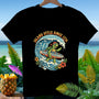 T-shirt graphic of a surfing turtle on a wave with "Aloha America 250" text.