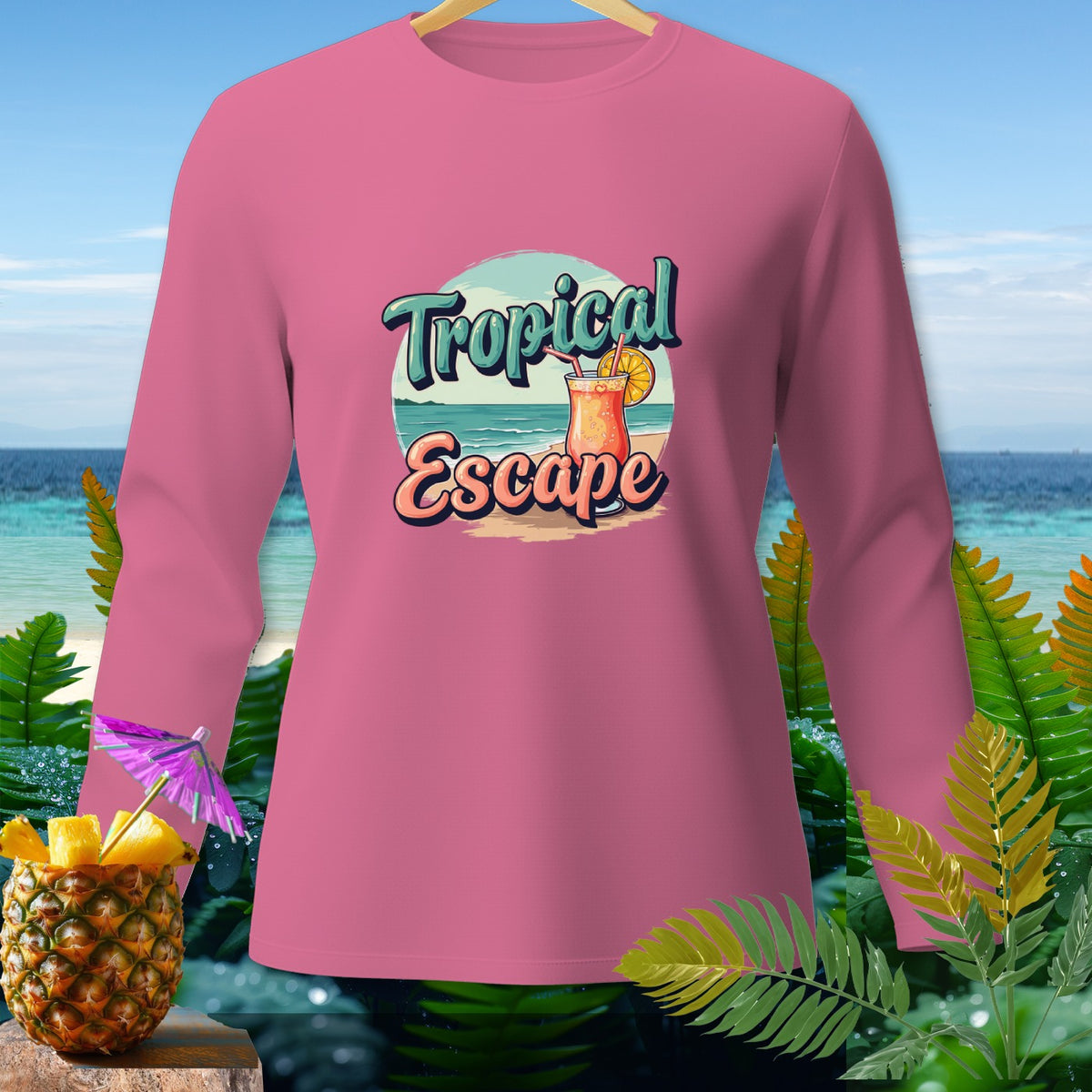 Pink long-sleeve shirt with "Tropical Escape" text and tropical drink graphic.