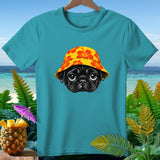 Teal t-shirt with a black pug wearing a yellow hibiscus-patterned hat.
