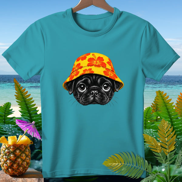 Teal t-shirt with a black pug wearing a yellow hibiscus-patterned hat.