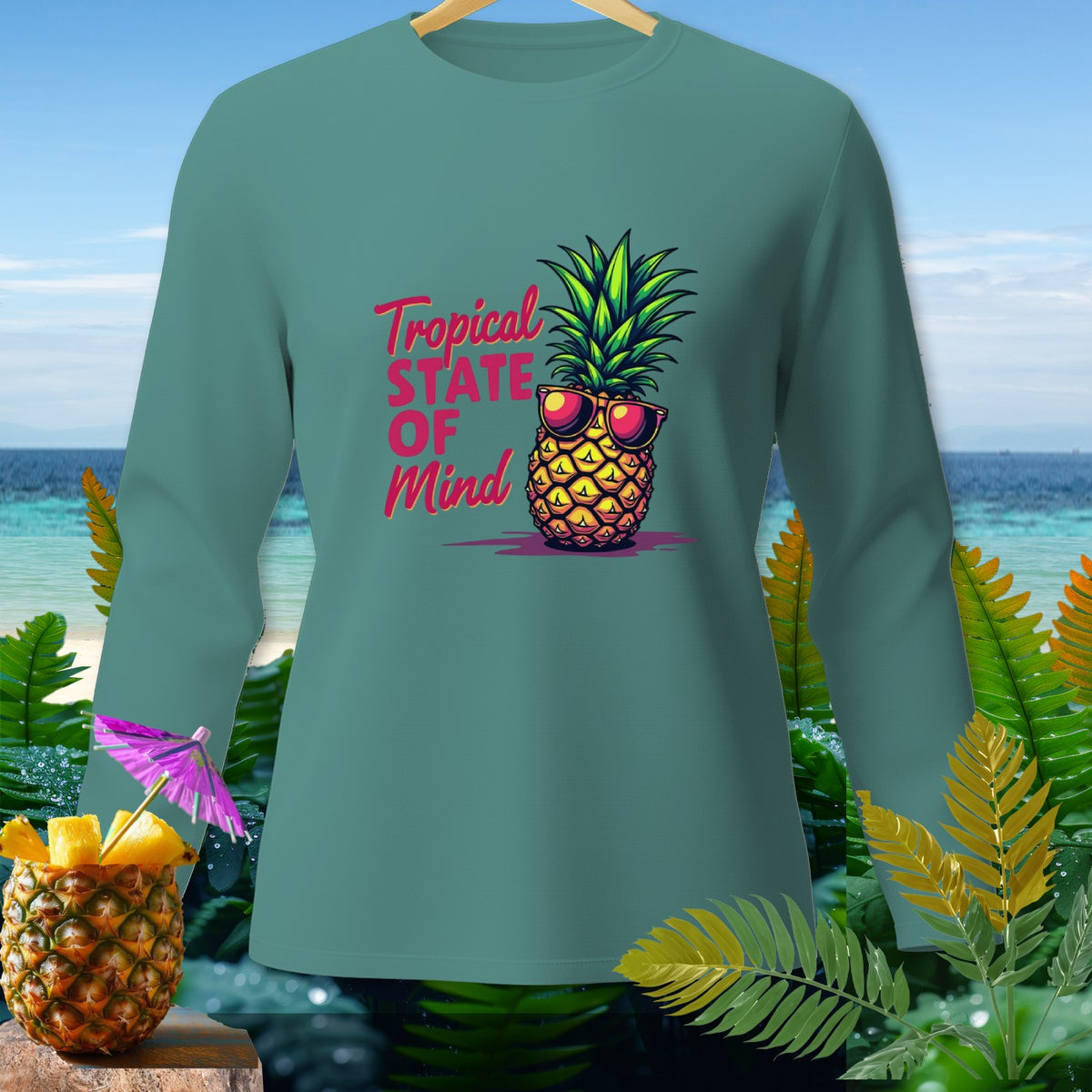 Teal long-sleeve shirt with sunglasses-wearing pineapple and text "Tropical State Of Mind".