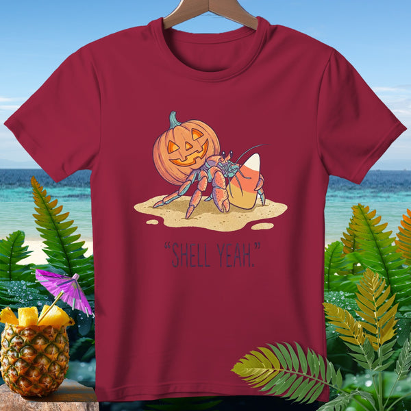 Hermit crab with pumpkin and candy corn on beach, saying "Shell Yeah."