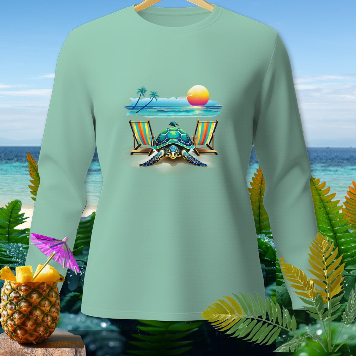 Light green long-sleeve shirt with a turtle, beach chairs, and sunset graphic.