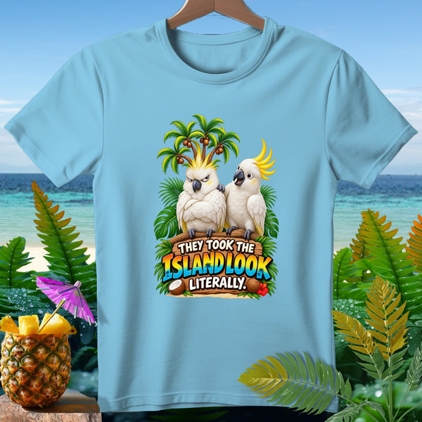 Two cockatoos on a log with "They Took The Island Look Literally" text.