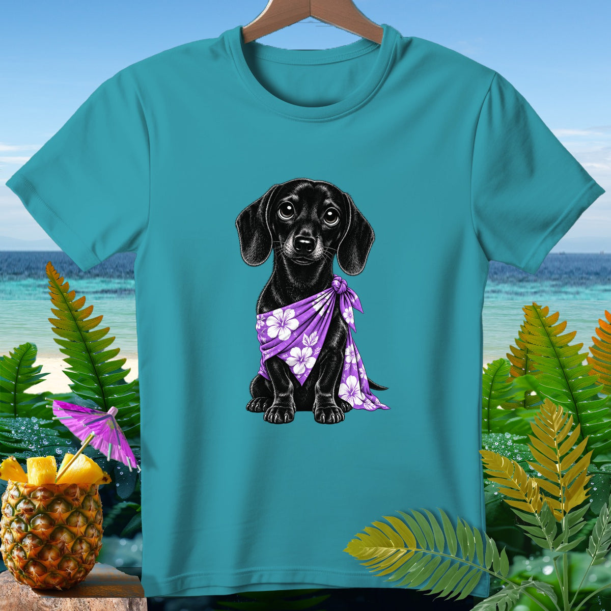 Teal t-shirt with a black dachshund wearing a purple floral bandana.