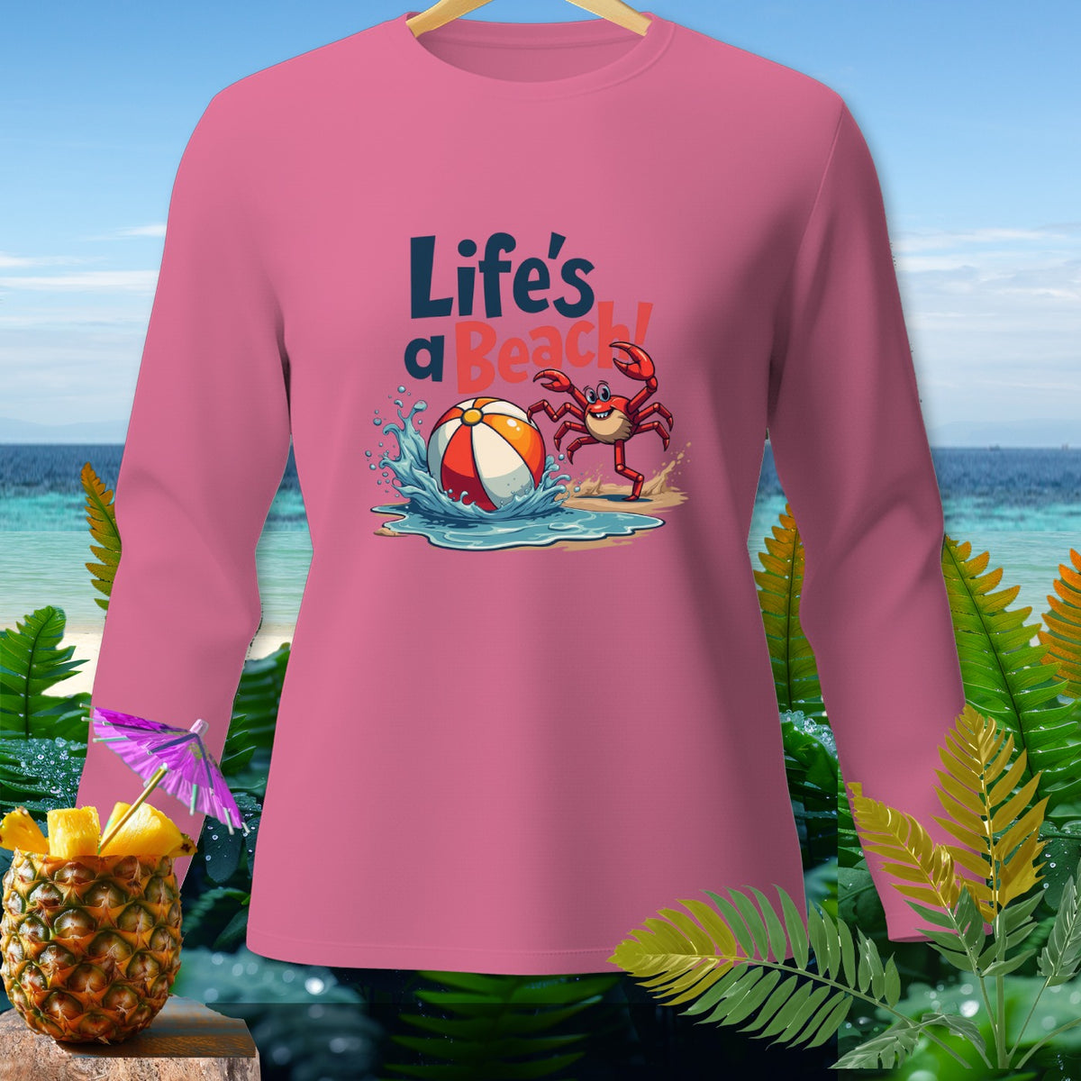 Pink long-sleeve shirt with cartoon crab, beach ball, and "Life's a Beach!" text.