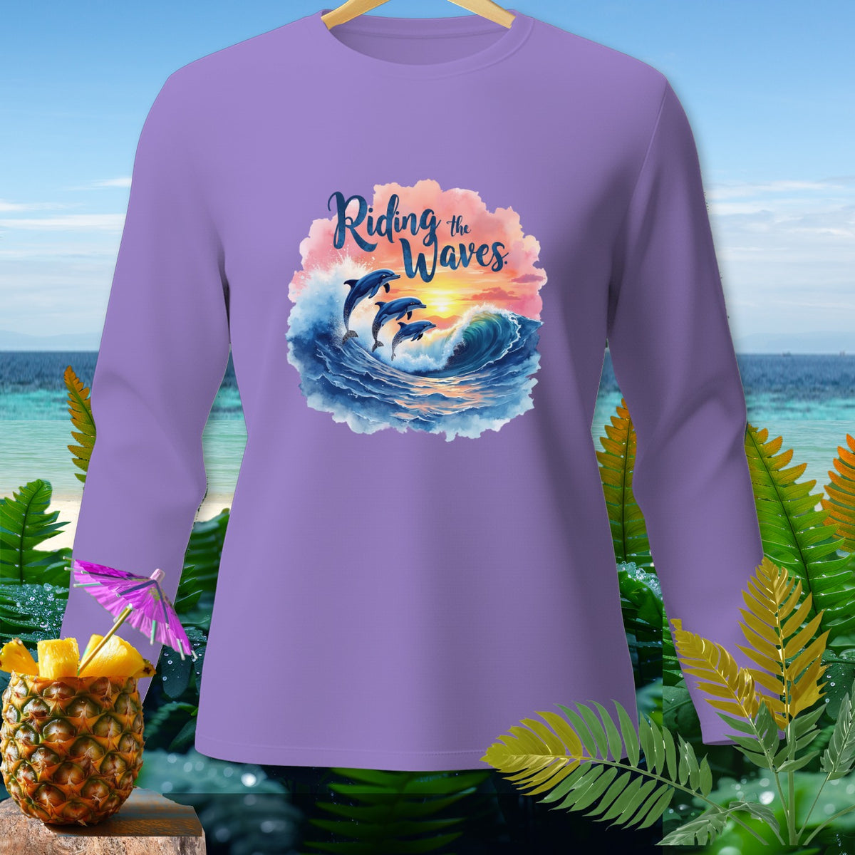 Purple long-sleeved shirt with dolphins jumping over waves and text "Riding the Waves".
