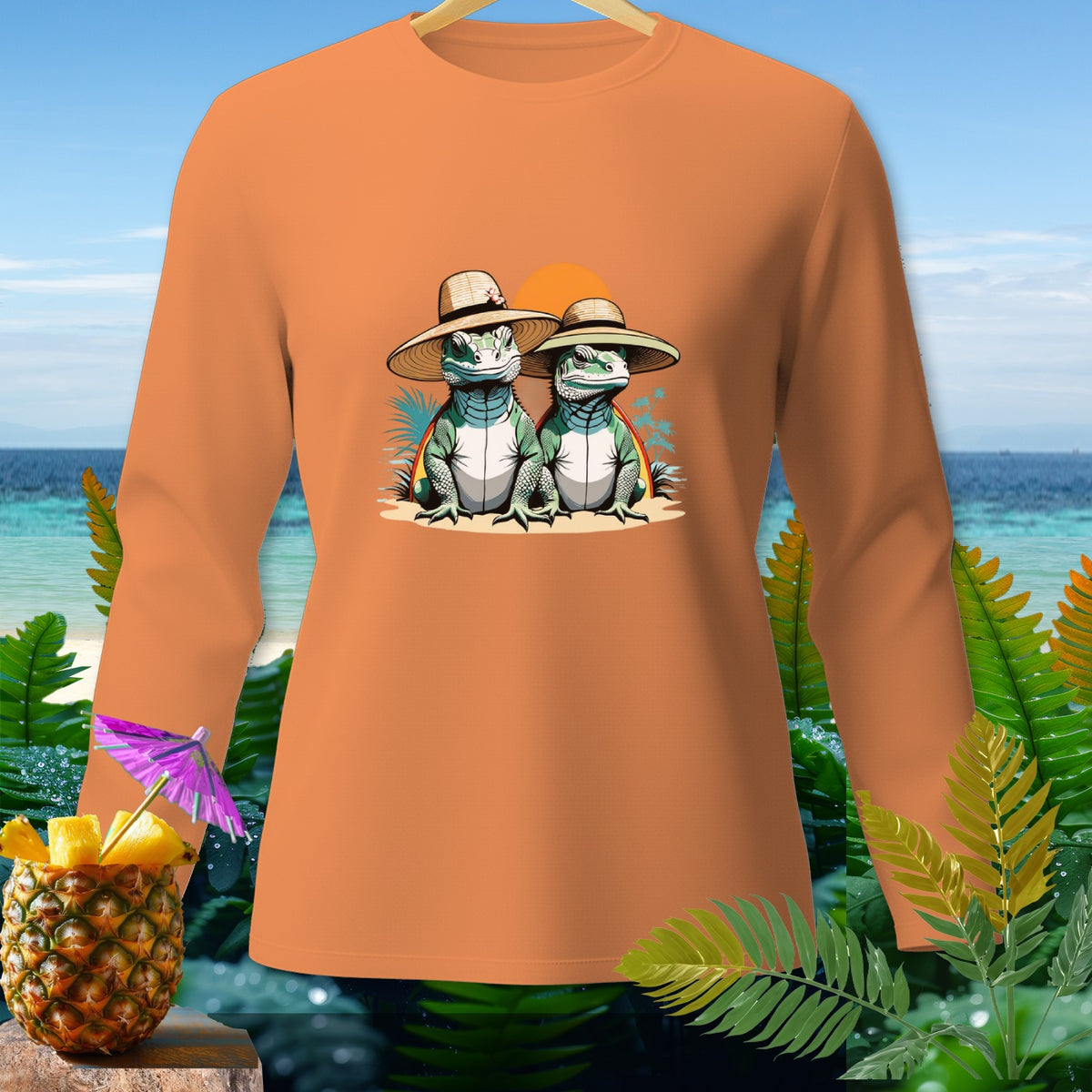 Orange long-sleeve shirt with two cartoon lizards wearing hats on a beach.