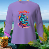 Long sleeve shirt with a blue iguana relaxing in a beach chair, text 