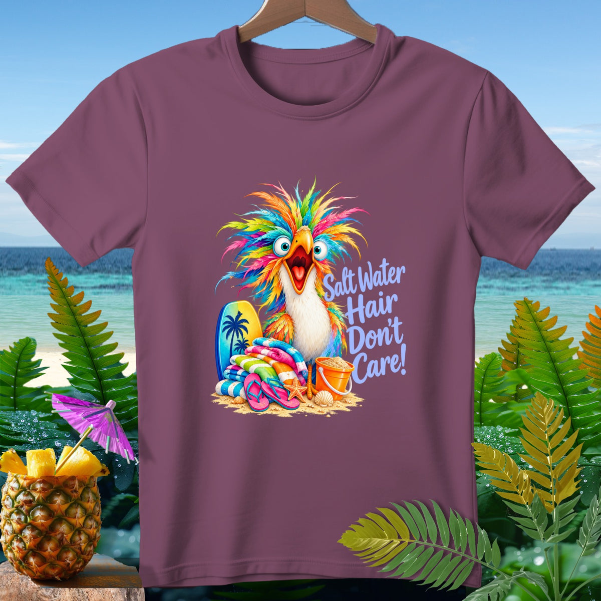 T-shirt with colorful parrot graphic and text "Salt Water Hair Don't Care!"
